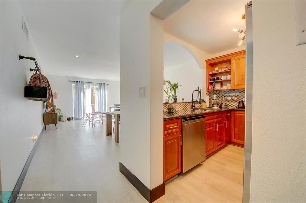 18111 Northwest 68th Avenue, Unit I210 Hialeah, FL 33015 - Photo 3 of 23 a kitchen with stainless steel appliances a refrigerator and a sink
