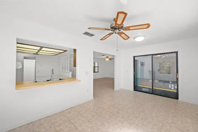 a bathroom with a sink a toilet a mirror and bathtub