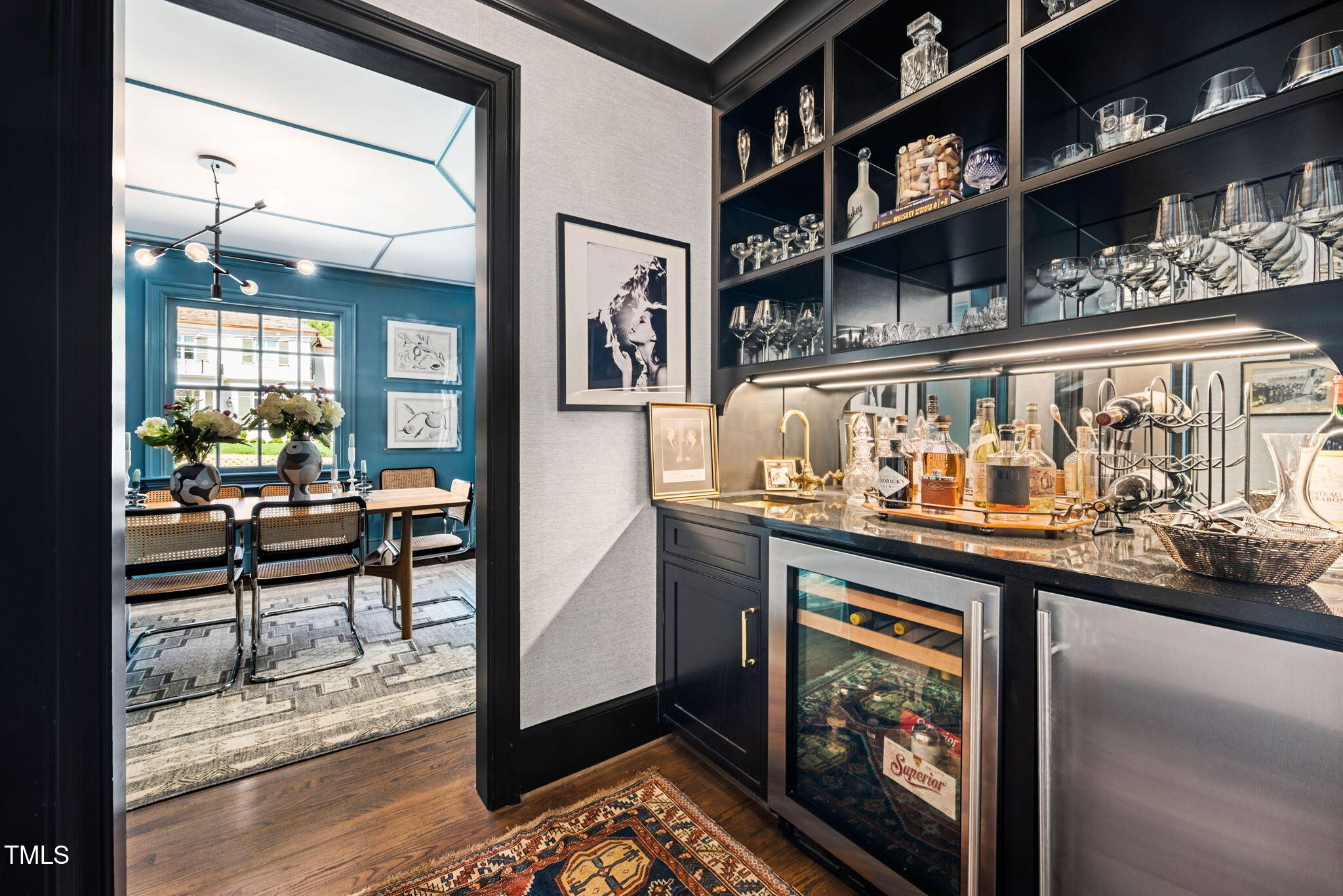 1619 Craig Street Raleigh, NC 27608 - Photo 15 of 49 a kitchen with stainless steel appliances granite countertop a lot of cabinets and wooden floor