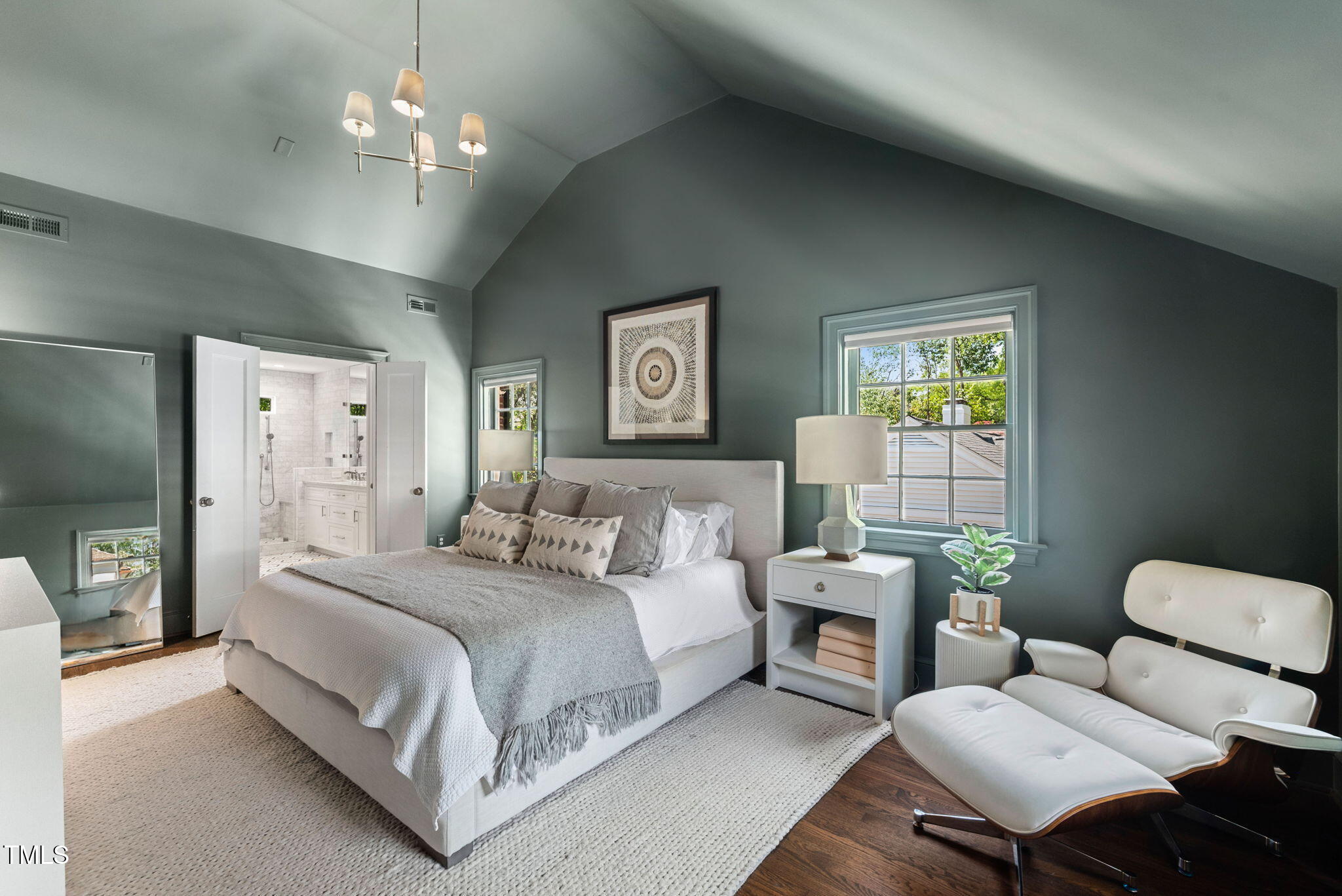 1619 Craig Street Raleigh, NC 27608 - Photo 23 of 49 a bedroom with a bed mirror and window