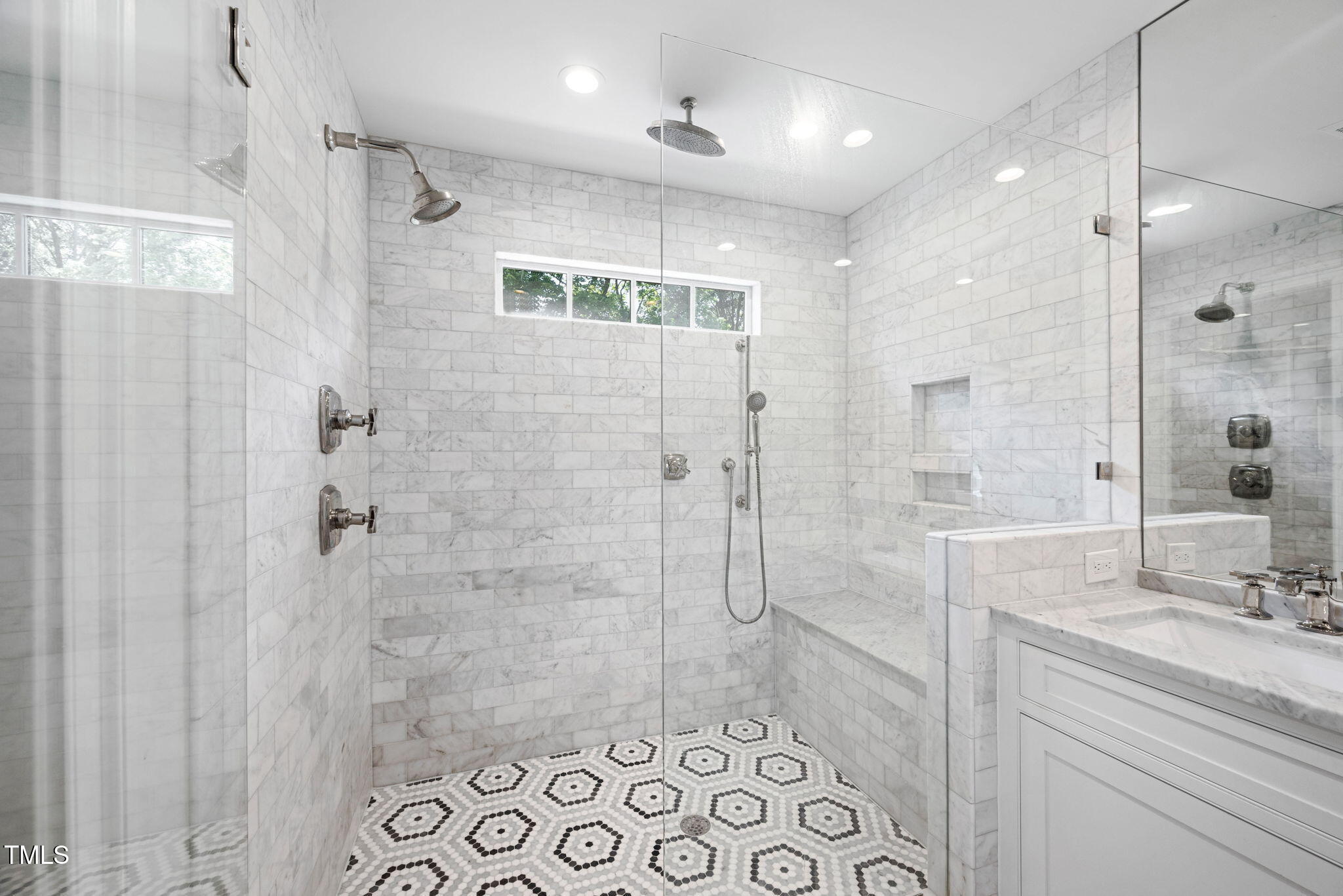 1619 Craig Street Raleigh, NC 27608 - Photo 26 of 49 a bathroom with a shower and a sink