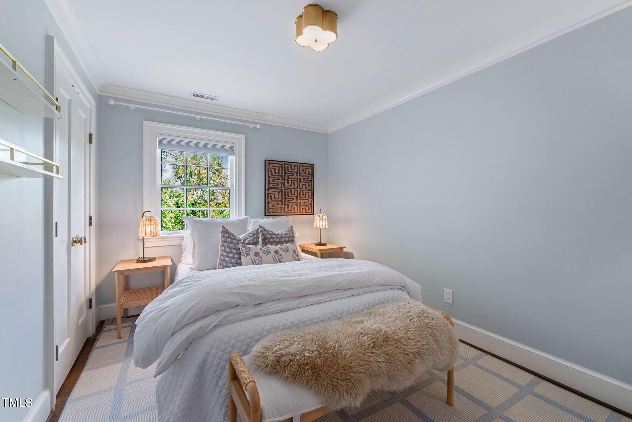 1619 Craig Street Raleigh, NC 27608 - Photo 27 of 49 a bedroom with a bed and a window