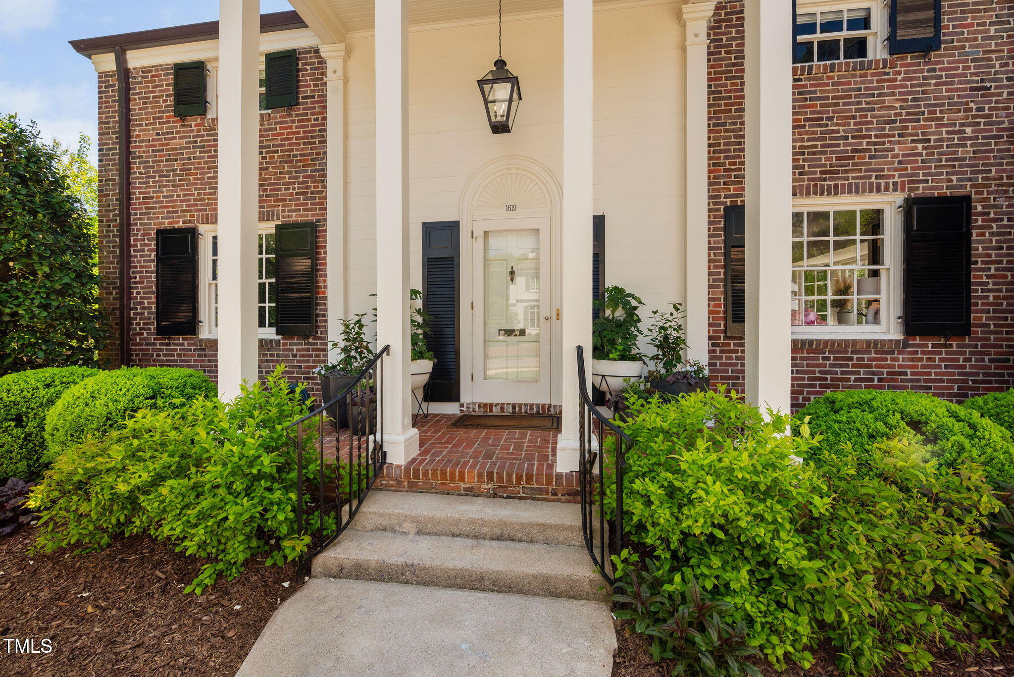 1619 Craig Street Raleigh, NC 27608 - Photo 3 of 49 a front view of a house with a porch
