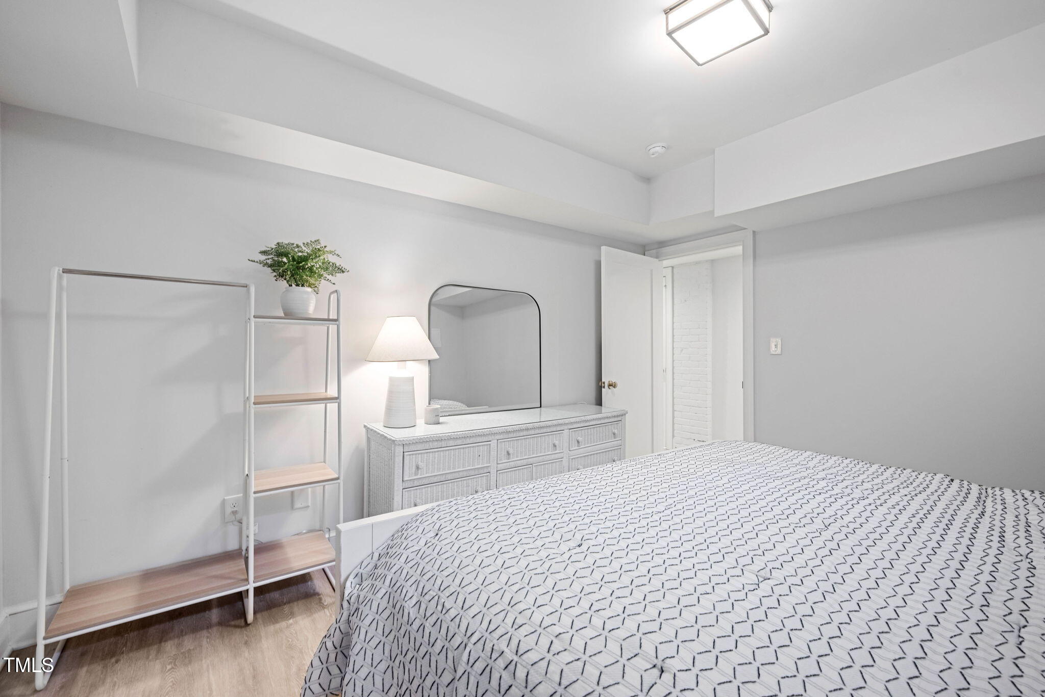 1619 Craig Street Raleigh, NC 27608 - Photo 35 of 49 a bedroom with a bed potted plant and a window