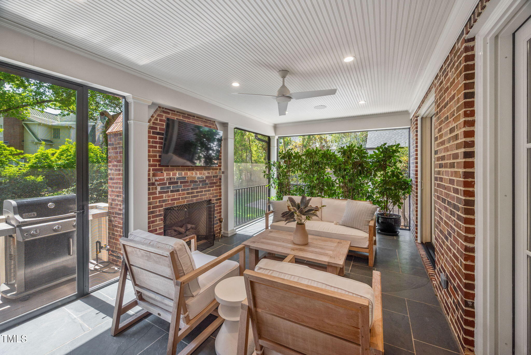 1619 Craig Street Raleigh, NC 27608 - Photo 41 of 49 a living room with fireplace furniture large windows