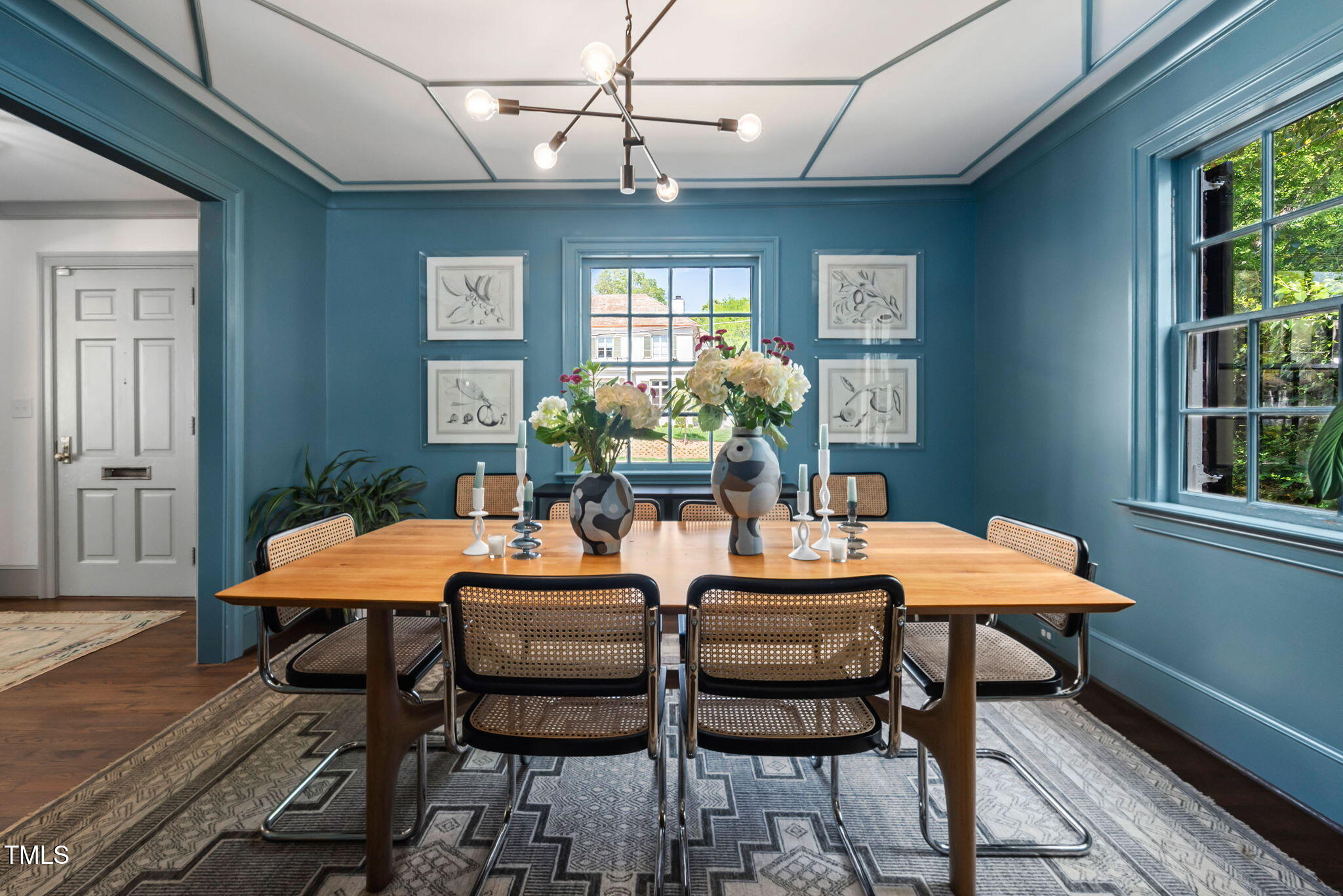 1619 Craig Street Raleigh, NC 27608 - Photo 7 of 49 a outdoor dining space with furniture and chandelier