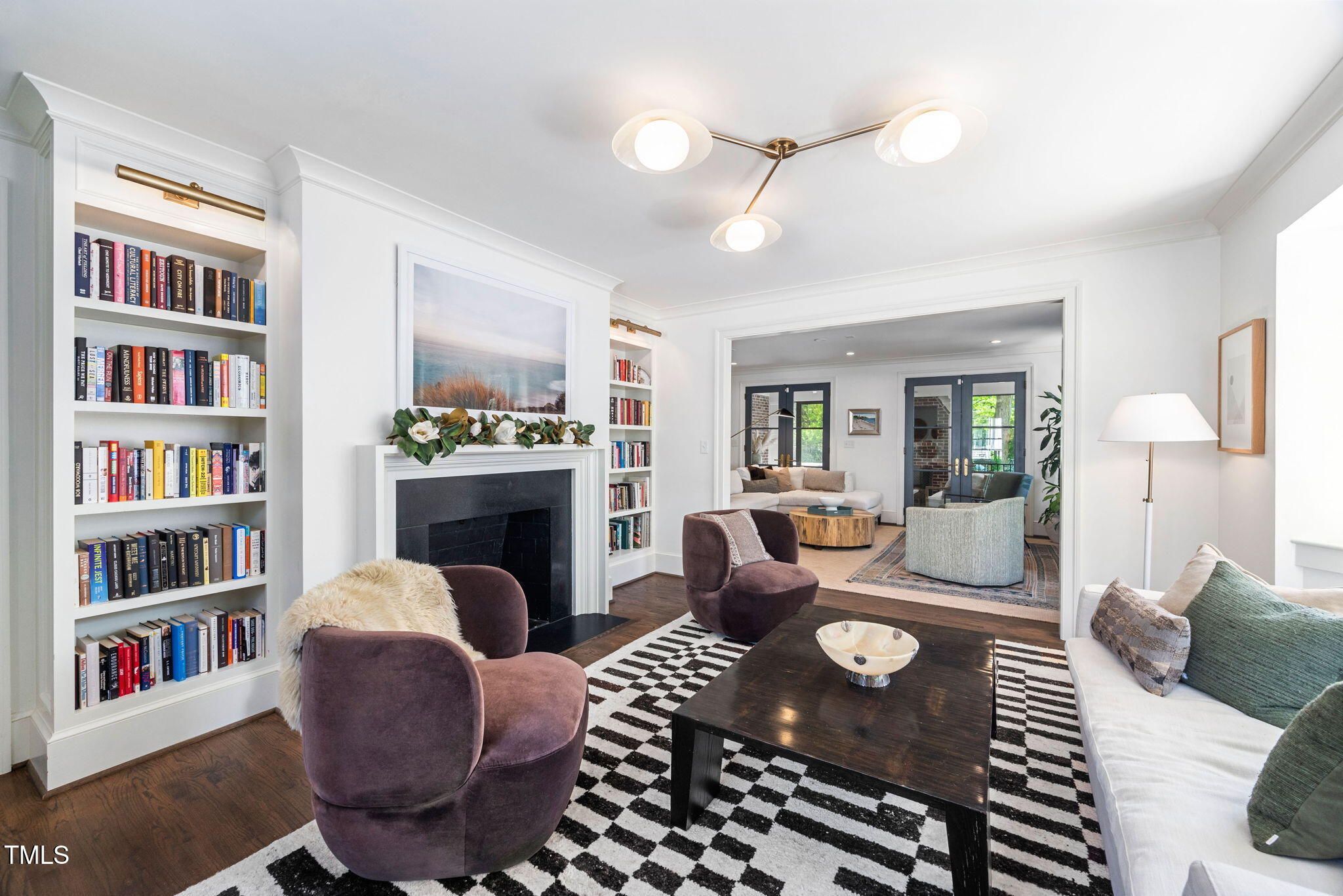 1619 Craig Street Raleigh, NC 27608 - Photo 9 of 49 a living room with furniture or fireplace and a book shelf