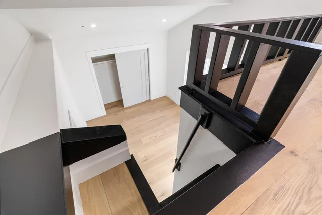a spacious bathroom with a double vanity sink mirror and bathtub