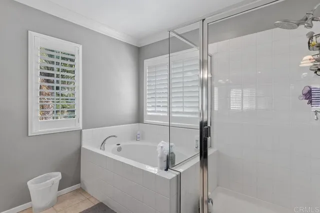 a white bath tub sitting next to a white sink