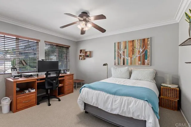 a bedroom with a workspace