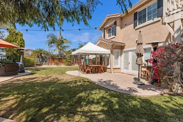 a view of a house with swimming pool and sitting area