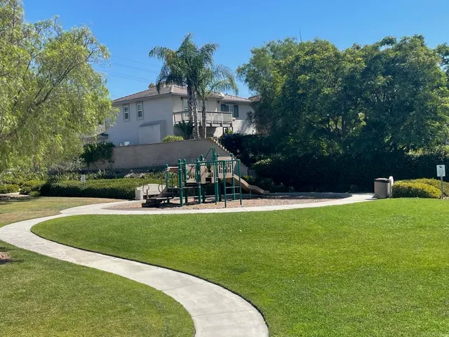 a view of a house with a yard porch and sitting area