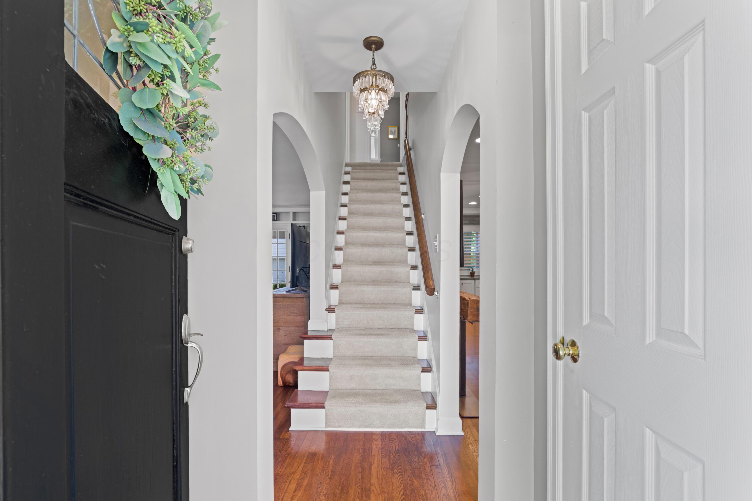 41 Aldrich Road Columbus, OH 43214 - Photo 4 of 52 Entry into Foyer with coat closet and mail slot, with views of the double archways and staircase