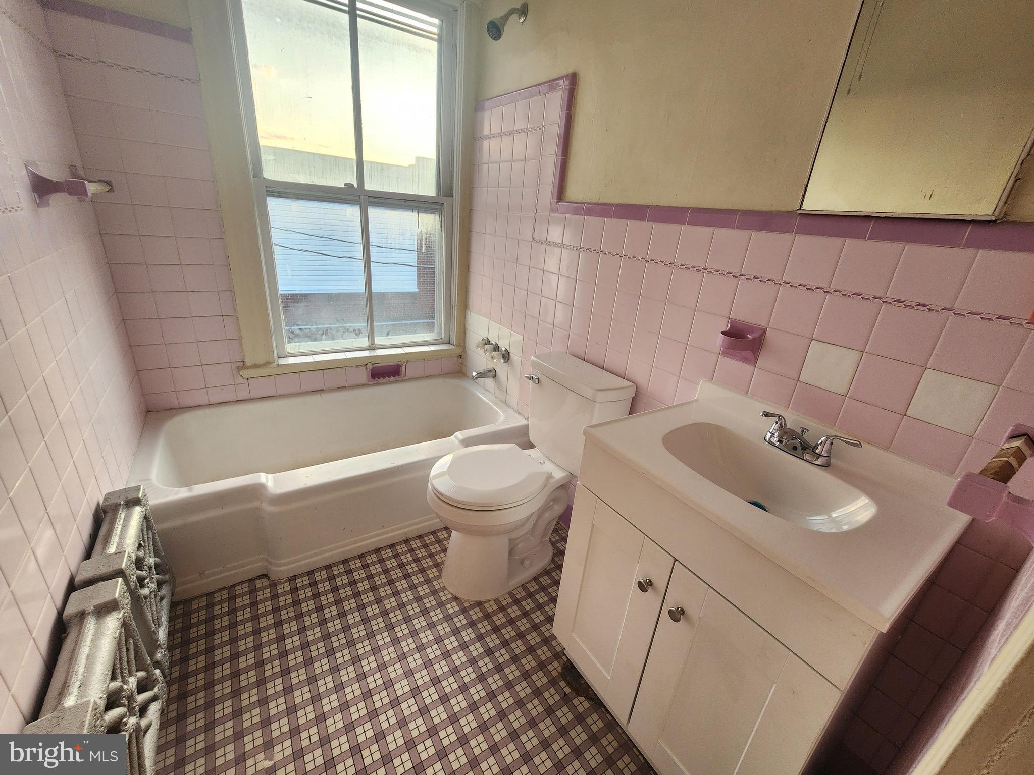 105 Park Street Cumberland, MD 21502 - Photo 15 of 18 a bathroom with a sink a toilet and shower