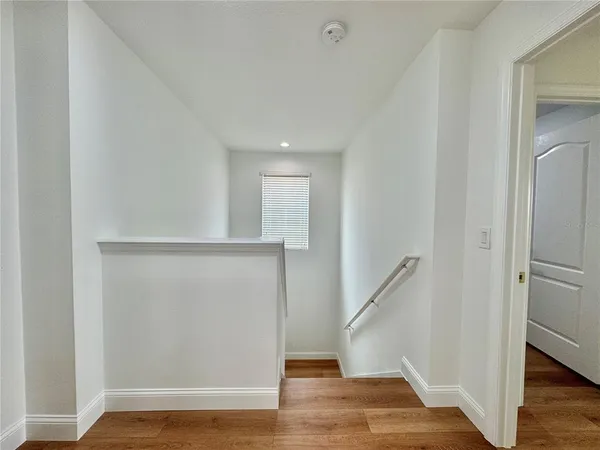 a view of entryway with wooden floor