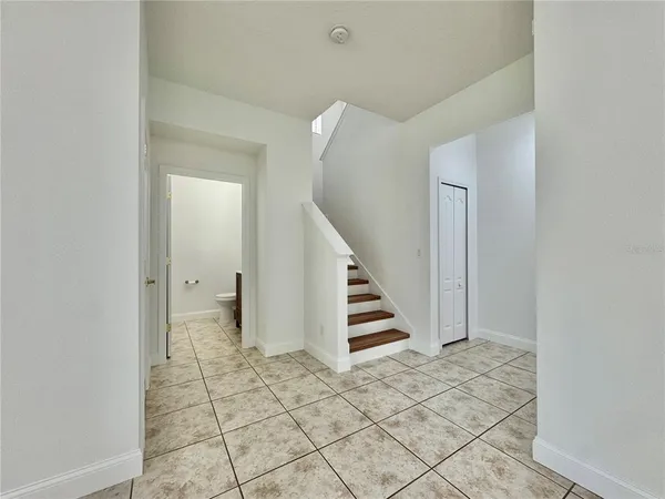 a view of entryway and hall with a window
