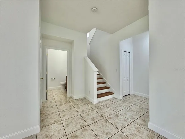 a view of entryway and hall with a window