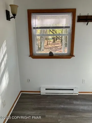 a view of a door with wooden floor