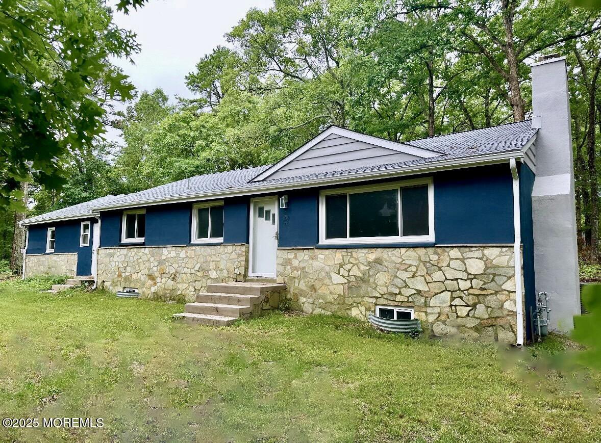 135 South Main Street Barnegat, NJ 08005 - Photo 1 of 35 a front view of a house with garden