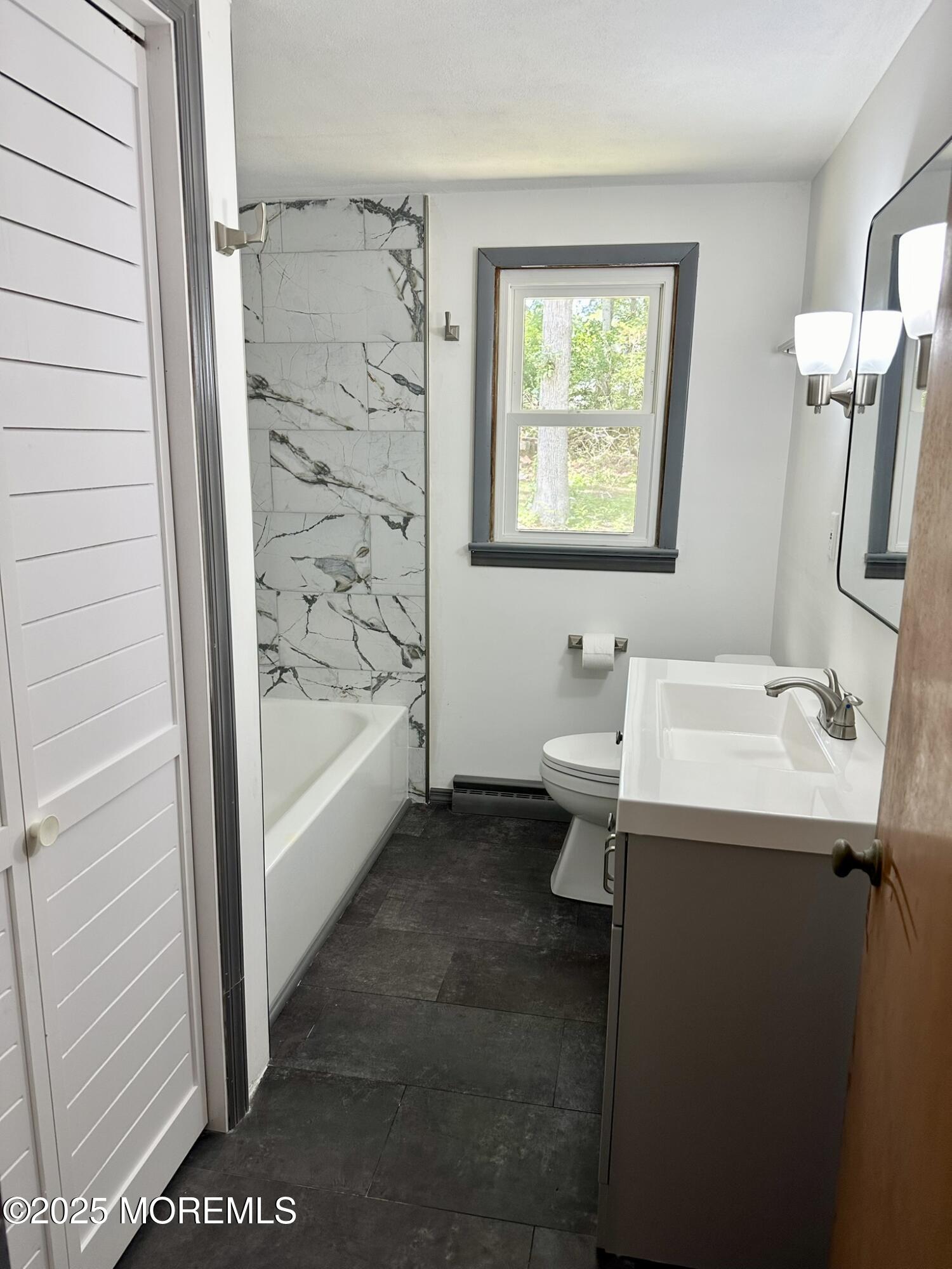 135 South Main Street Barnegat, NJ 08005 - Photo 13 of 35 a bathroom with a sink a toilet and shower