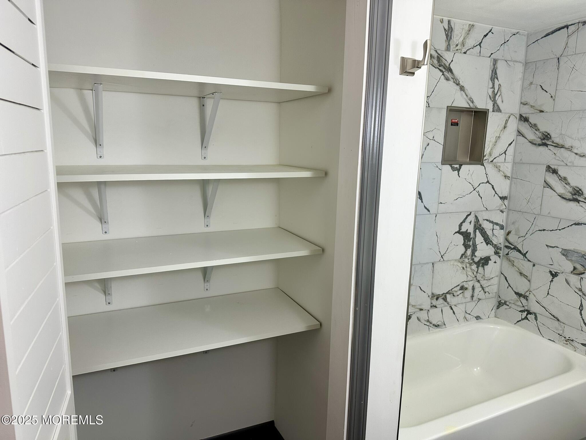 135 South Main Street Barnegat, NJ 08005 - Photo 15 of 35 a bathroom with a bathtub