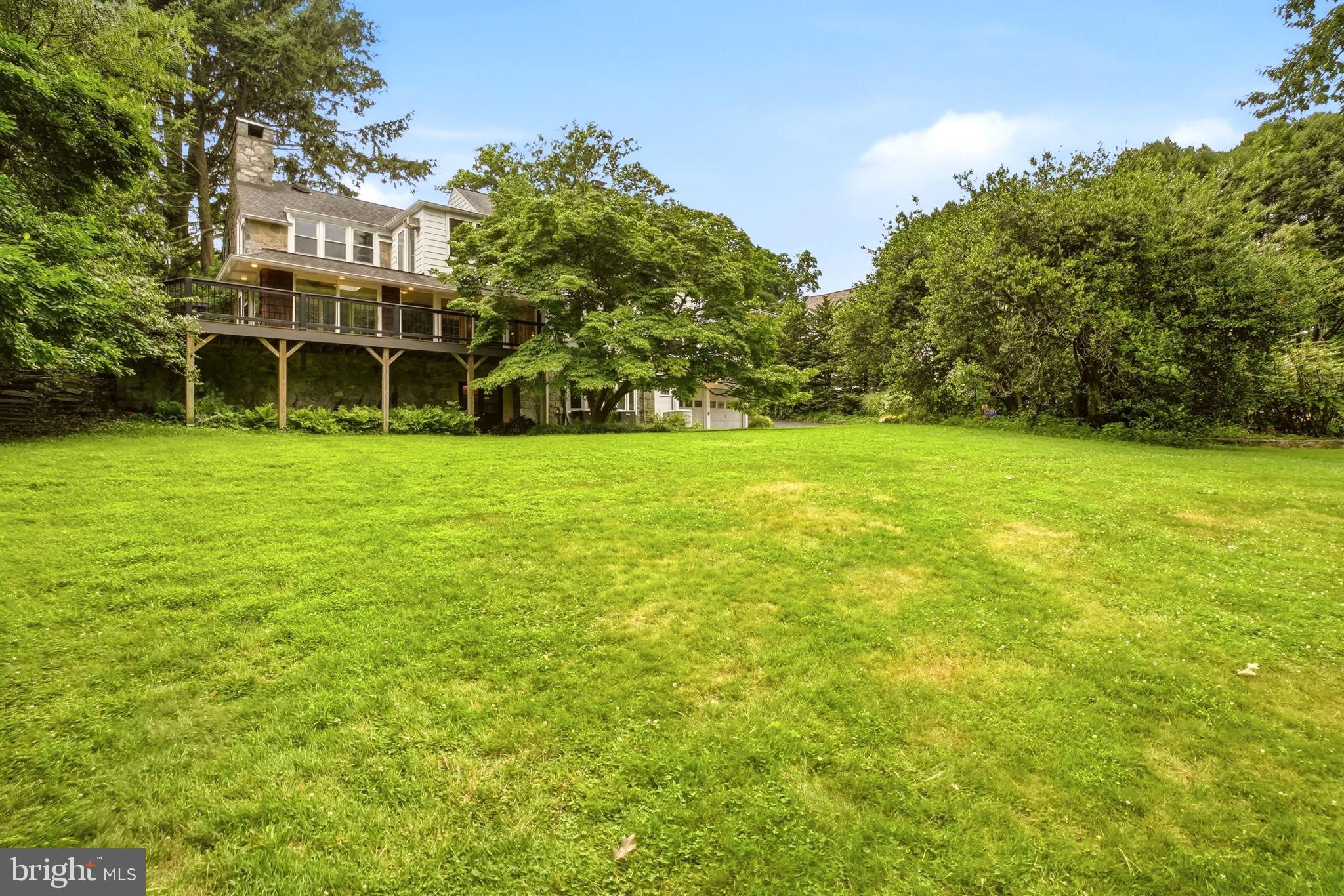 419 Riverview Road Swarthmore, PA 19081 - Photo 60 of 70 a view of a big yard with a building in the background
