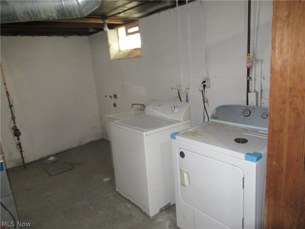 3824 East Antisdale Road Cleveland, OH 44118 - Photo 27 of 27 Basement laundry area with exposed overhead ductwork, concrete flooring, and a single window providing natural illumination