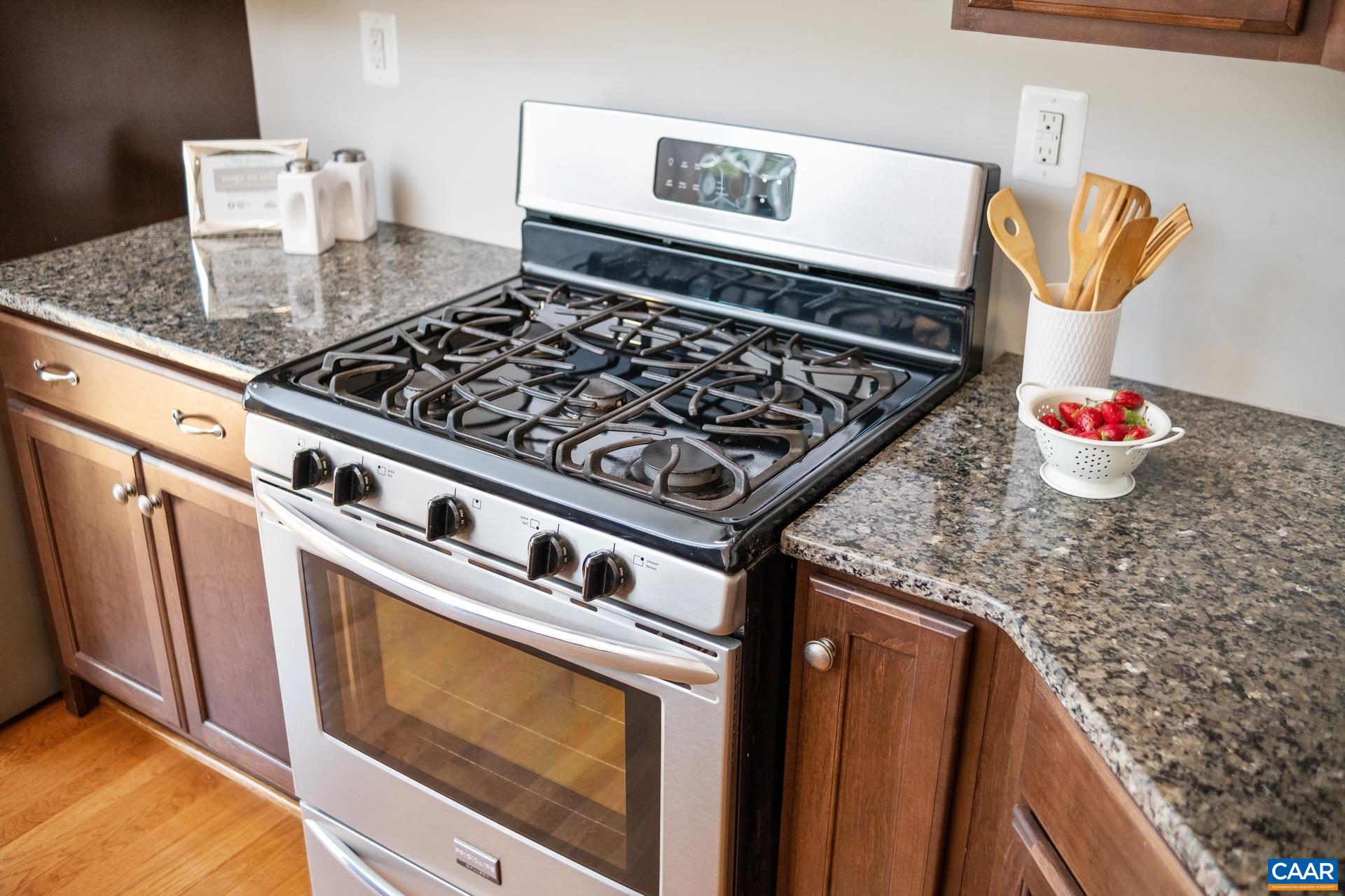 2104 Avinity Loop Charlottesville, VA 22902 - Photo 11 of 45 a stove top oven sitting inside of a kitchen