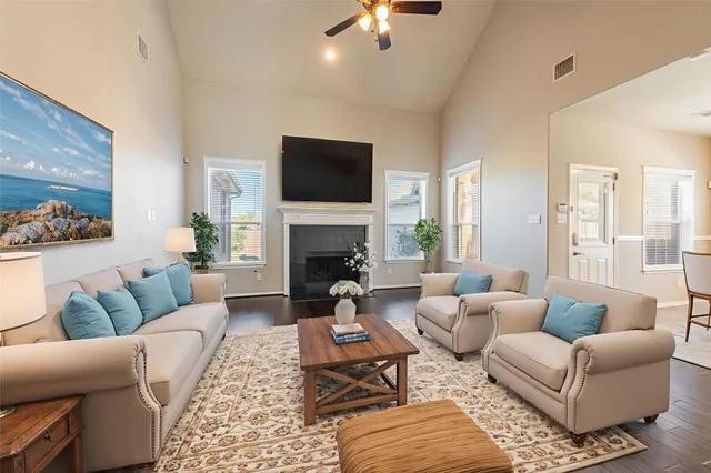a living room with furniture fireplace and a flat screen tv