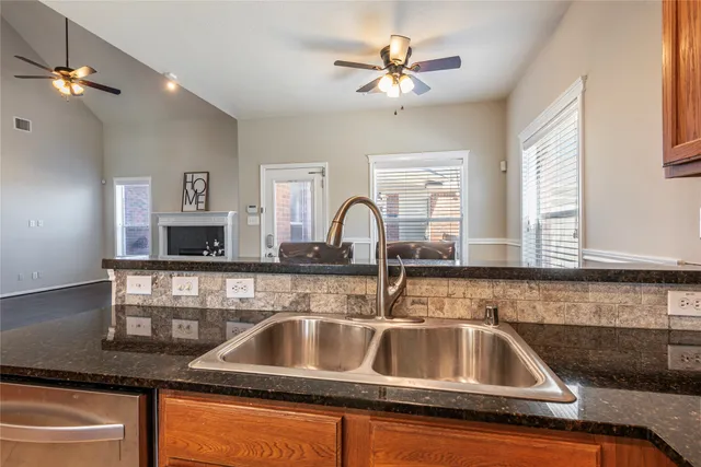a kitchen with a sink and a stove