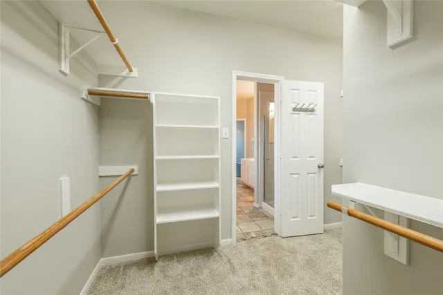 a view of an empty walk in closet