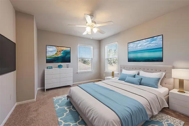 a bedroom with a large bed and a flat screen tv