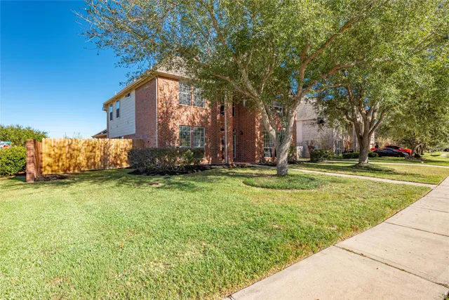 a backyard of a house with lots of green space