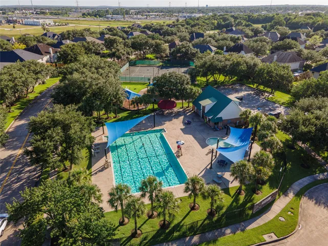 an aerial view of a house with a lake view