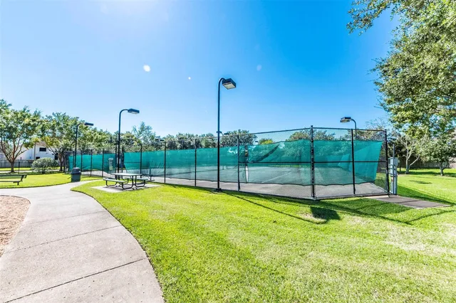 a view of a backyard with swimming pool