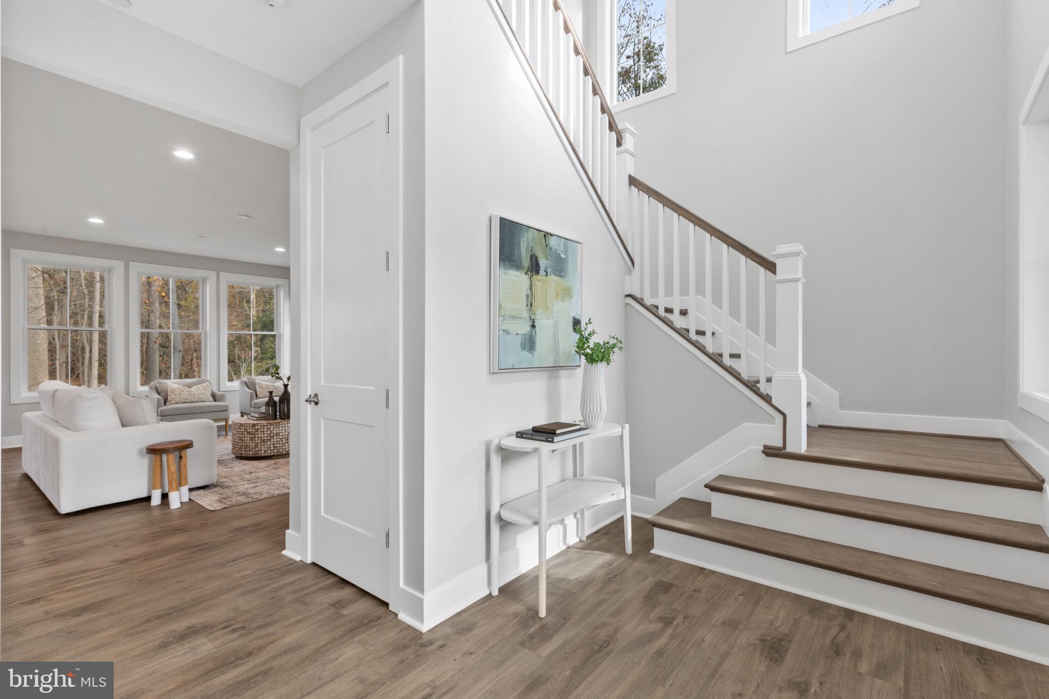 1402 Mccarter Lane Edgewater, MD 21037 - Photo 3 of 30 a view of entryway and hall with wooden floor