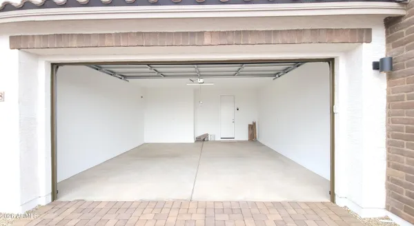 a view of a house with swimming pool and sitting area