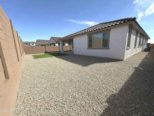a house view with a backyard space