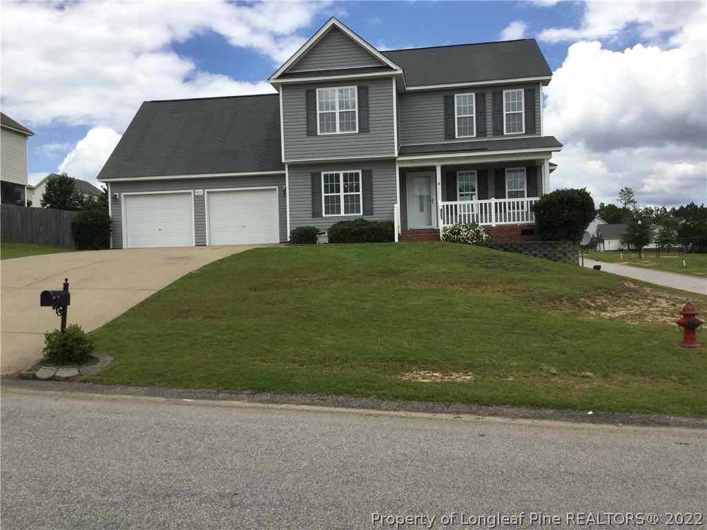 421 Hillandale Road Spring Lake, NC 28390 - Photo 1 of 18 a front view of a house with a garden