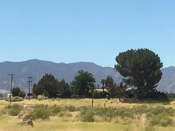 a view of a town with mountains in the background