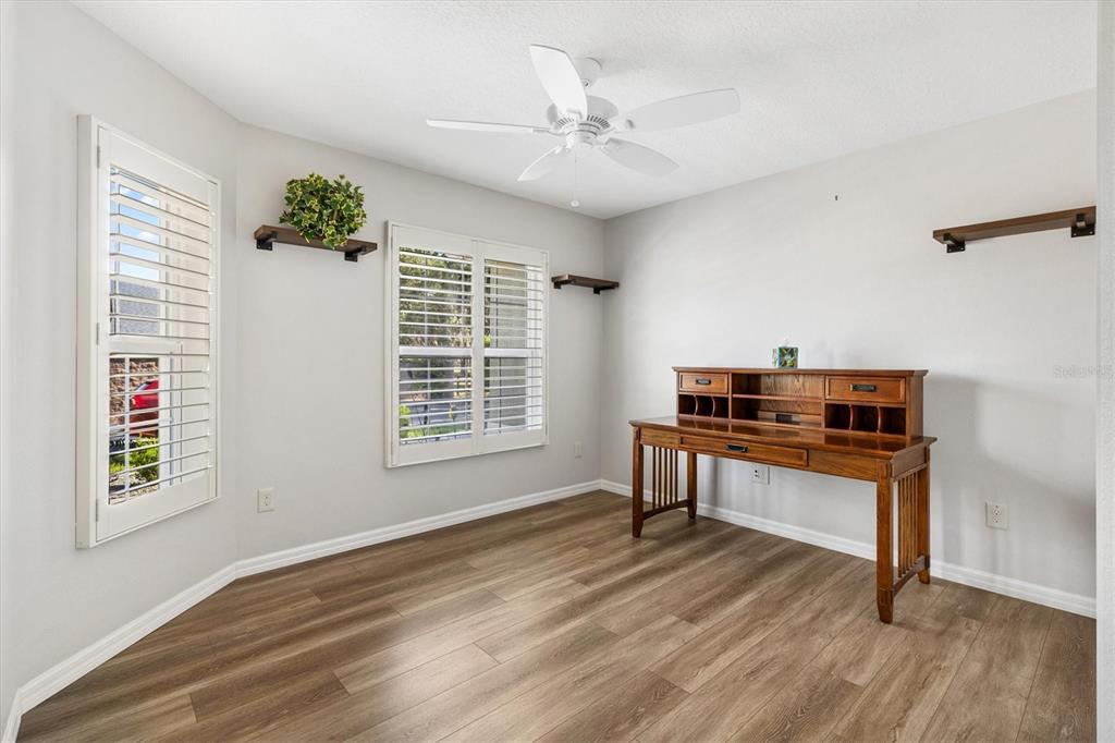 7351 Southeast 169th Cote Loop The Villages, FL 32162 - Photo 18 of 32 a room with furniture and a window