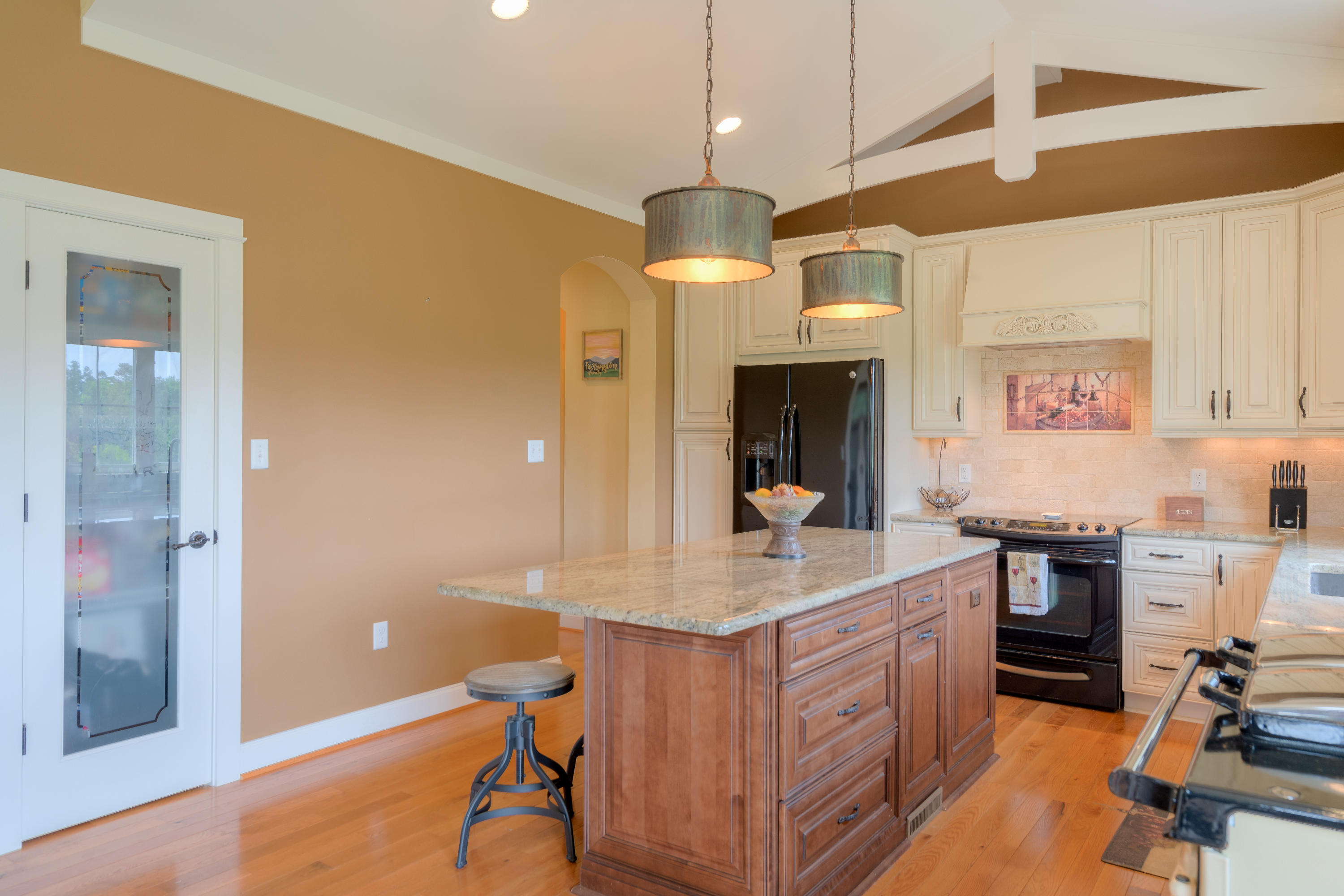 1839 Blue Ridge Springs Road Blue Ridge, VA 24064 - Photo 14 of 68 a room with kitchen island a wooden floor and a sink