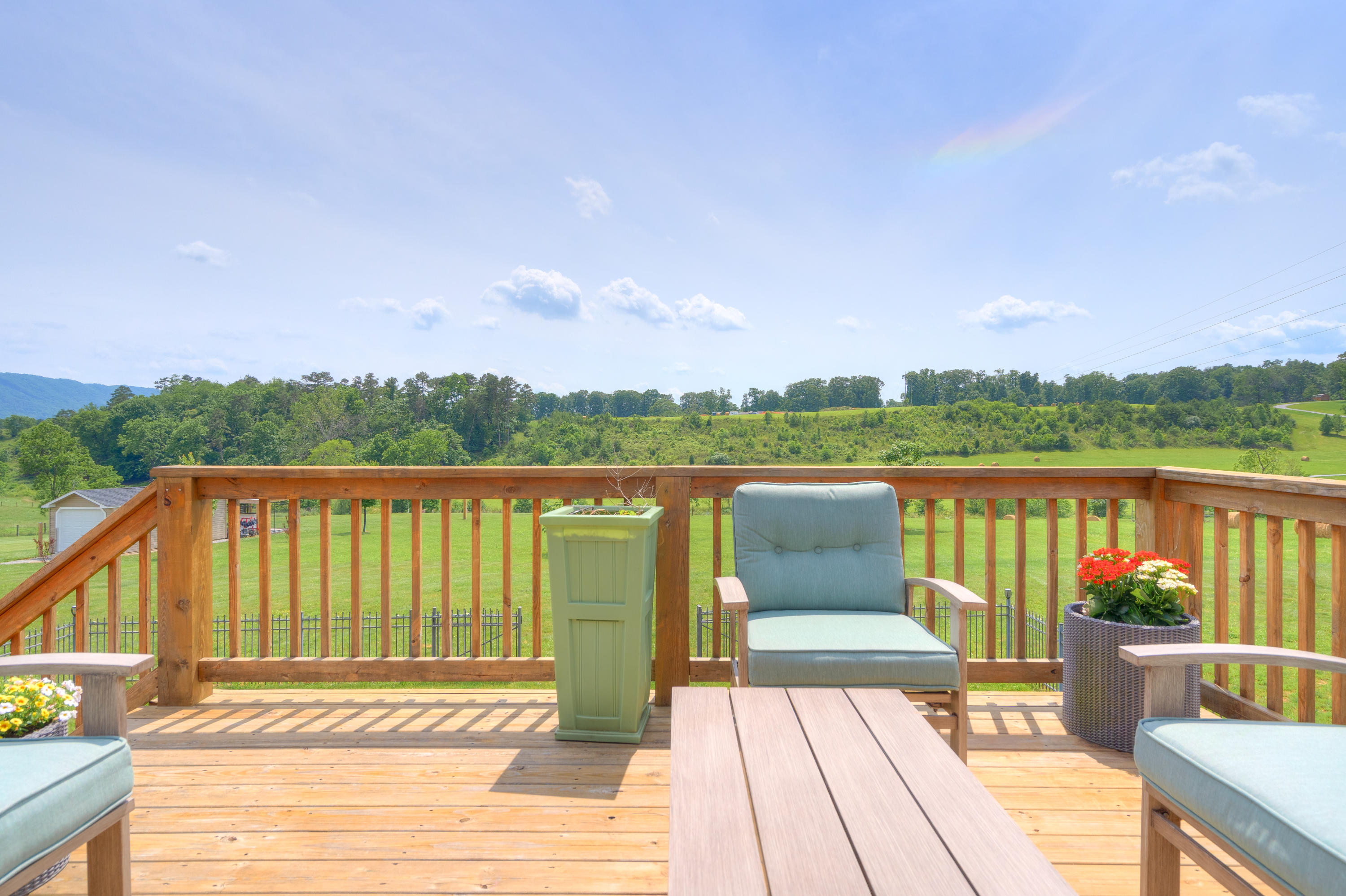 1839 Blue Ridge Springs Road Blue Ridge, VA 24064 - Photo 24 of 68 a view of a deck with wooden floor and fence next to a yard