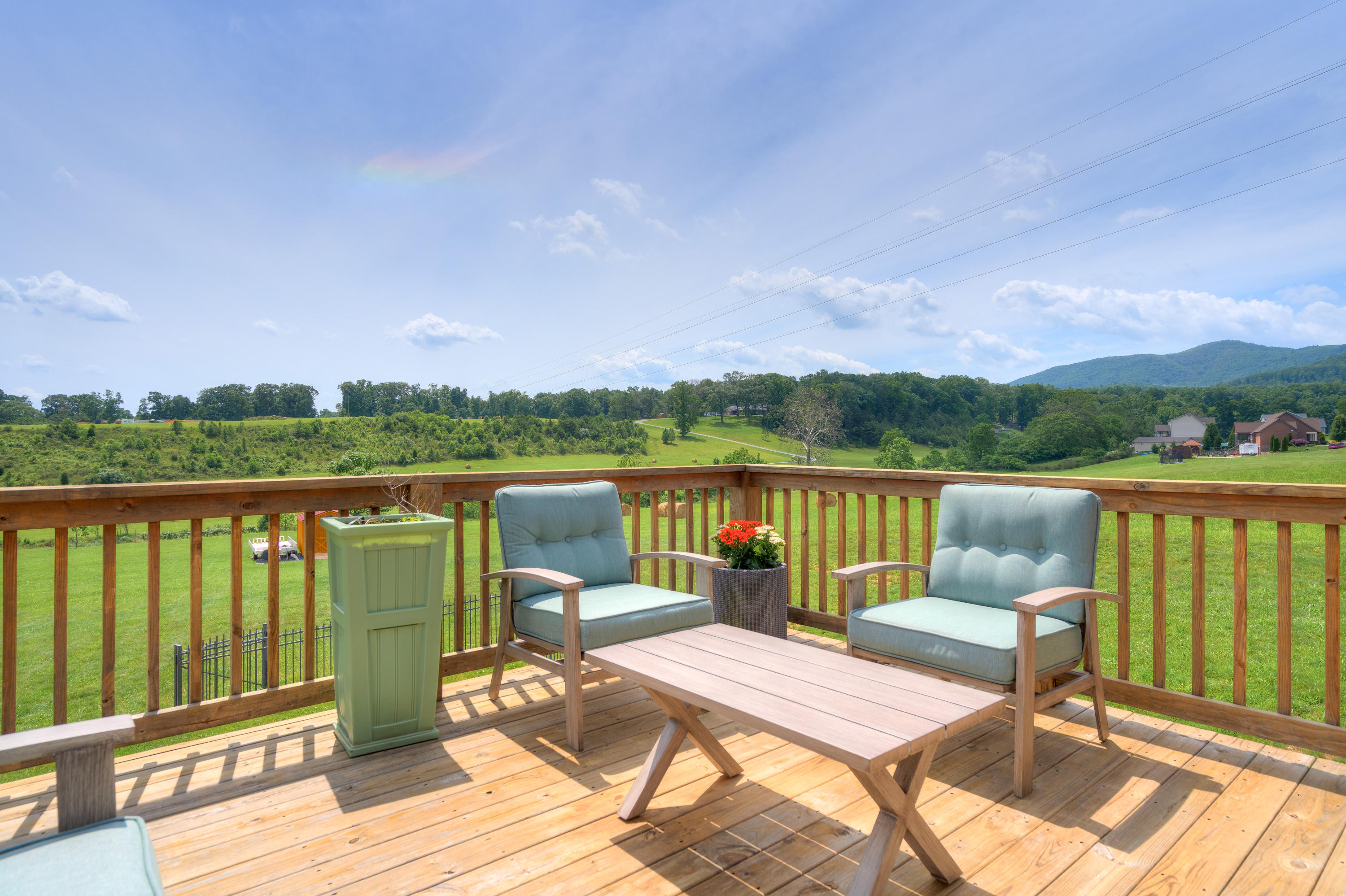 1839 Blue Ridge Springs Road Blue Ridge, VA 24064 - Photo 25 of 68 a view of a balcony with lake view and wooden floor