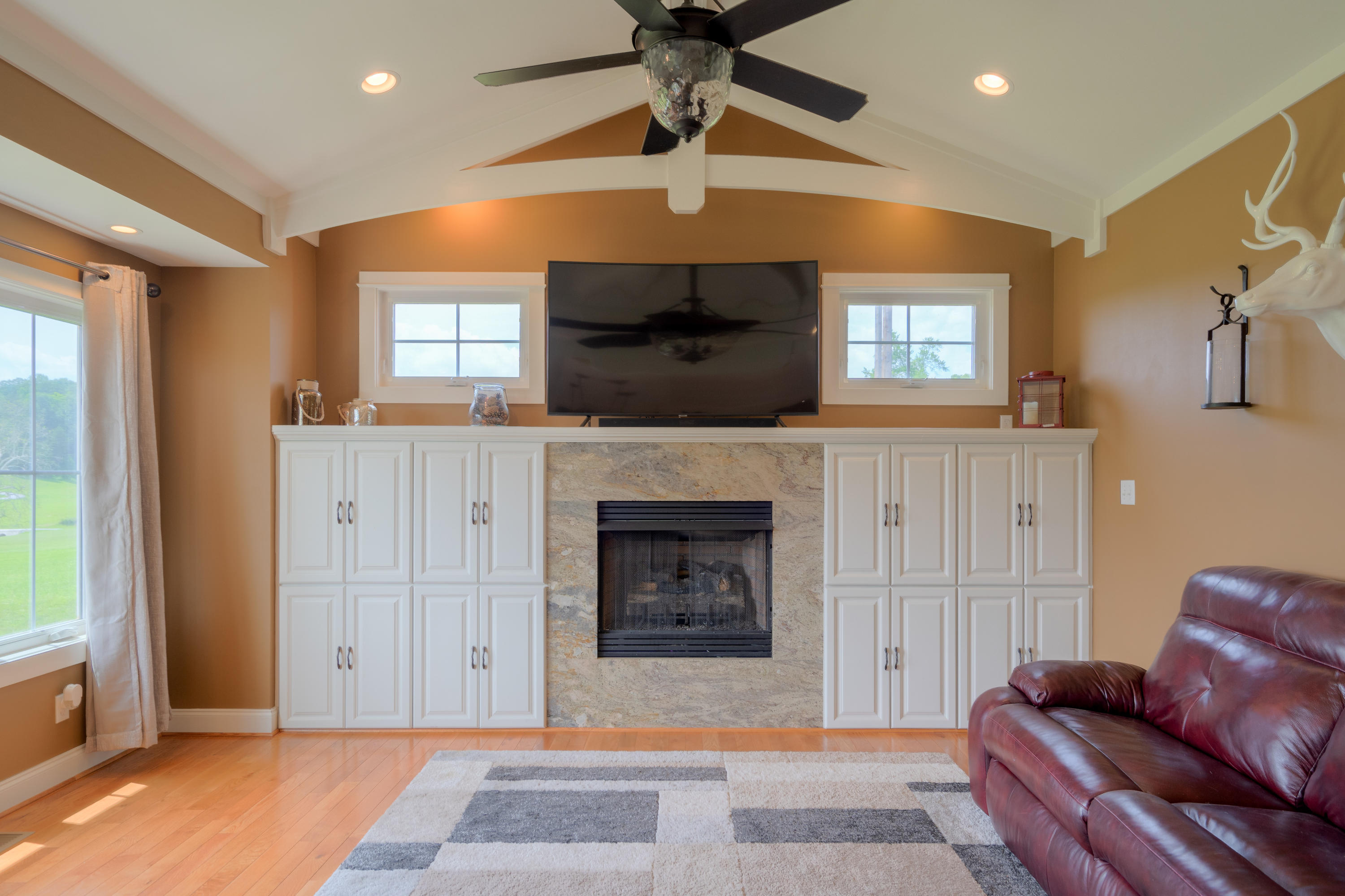 1839 Blue Ridge Springs Road Blue Ridge, VA 24064 - Photo 27 of 68 a living room with furniture a flat screen tv and a fireplace