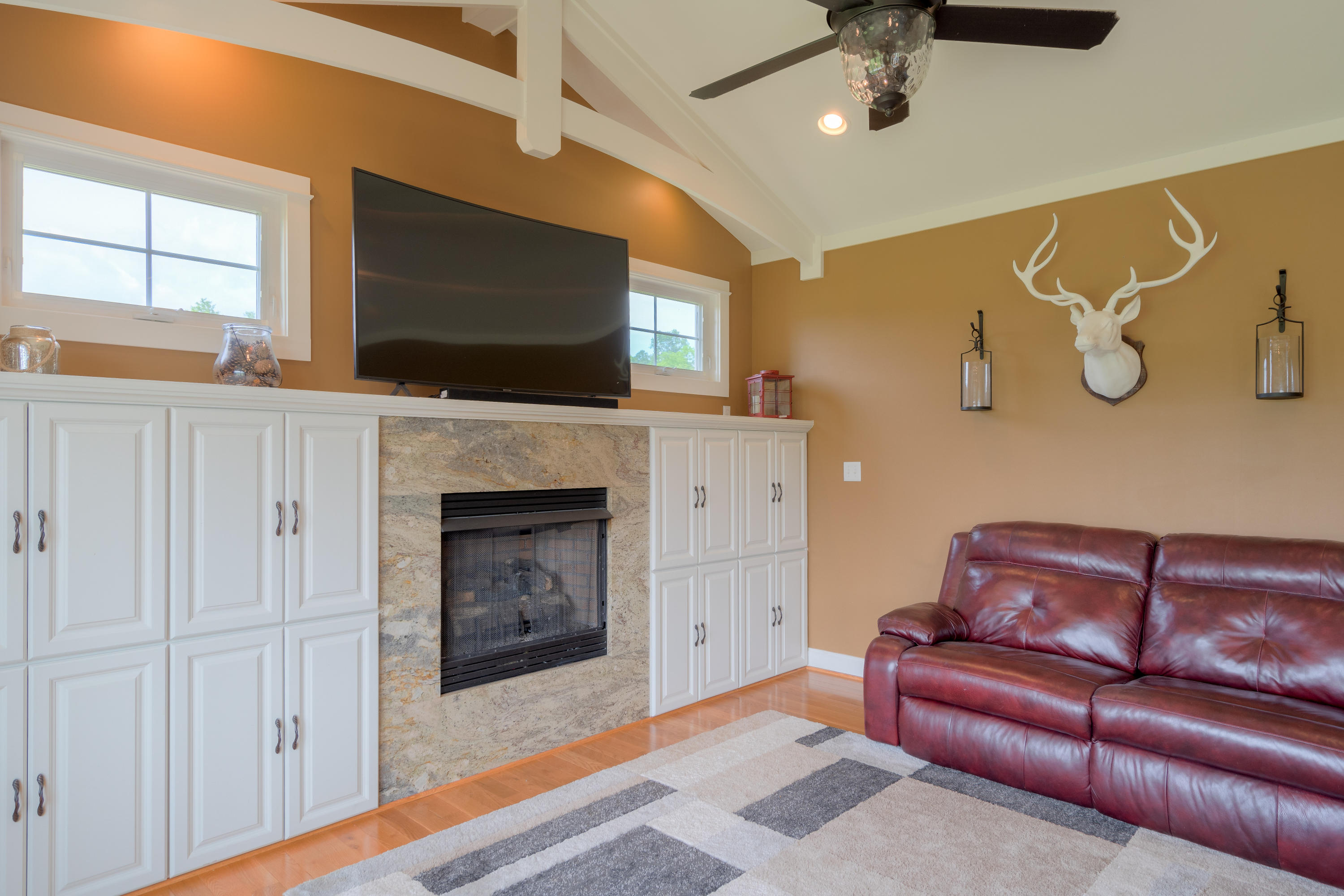 1839 Blue Ridge Springs Road Blue Ridge, VA 24064 - Photo 28 of 68 a living room with furniture a flat screen tv and a fireplace