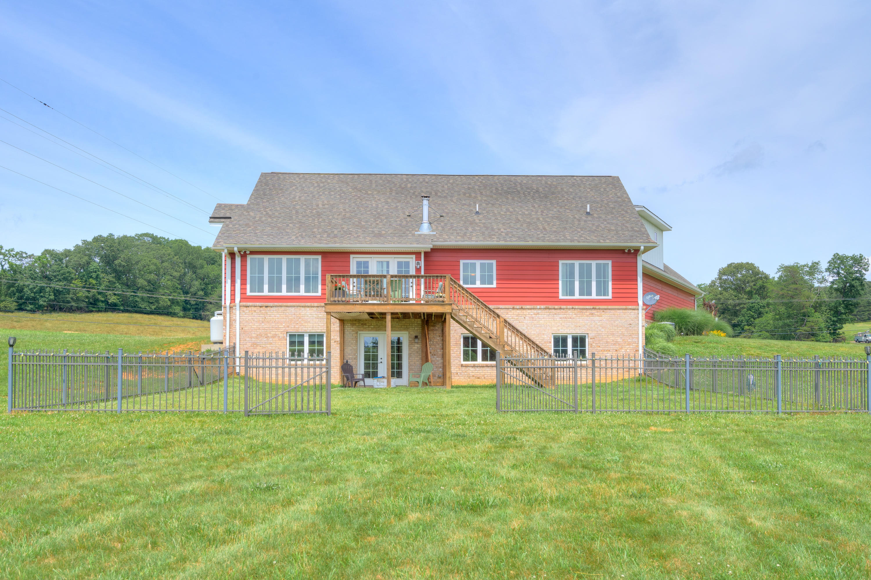 1839 Blue Ridge Springs Road Blue Ridge, VA 24064 - Photo 8 of 68 a view of a house with a big yard and a large tree