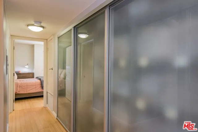 a bedroom with a bed and dresser