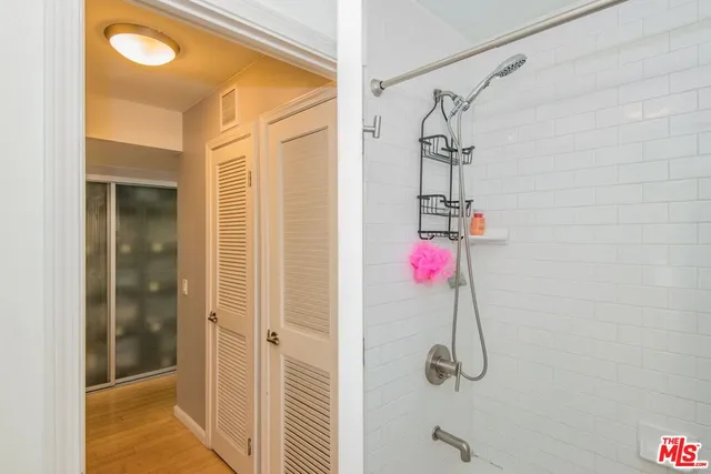 a view of a hallway with washer and dryer