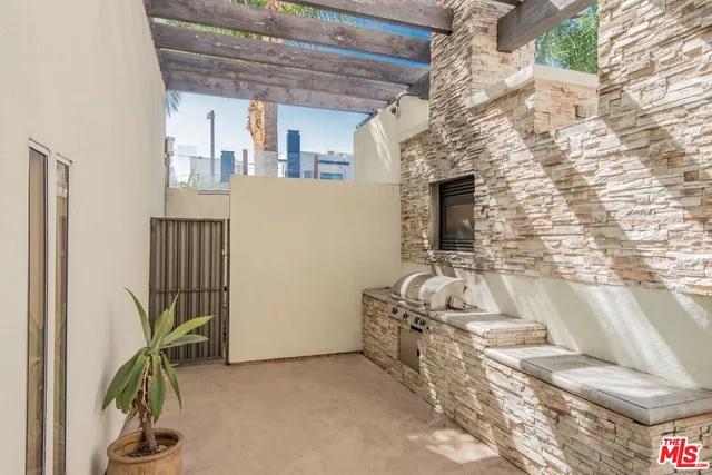 a living room filled with furniture and a flat screen tv